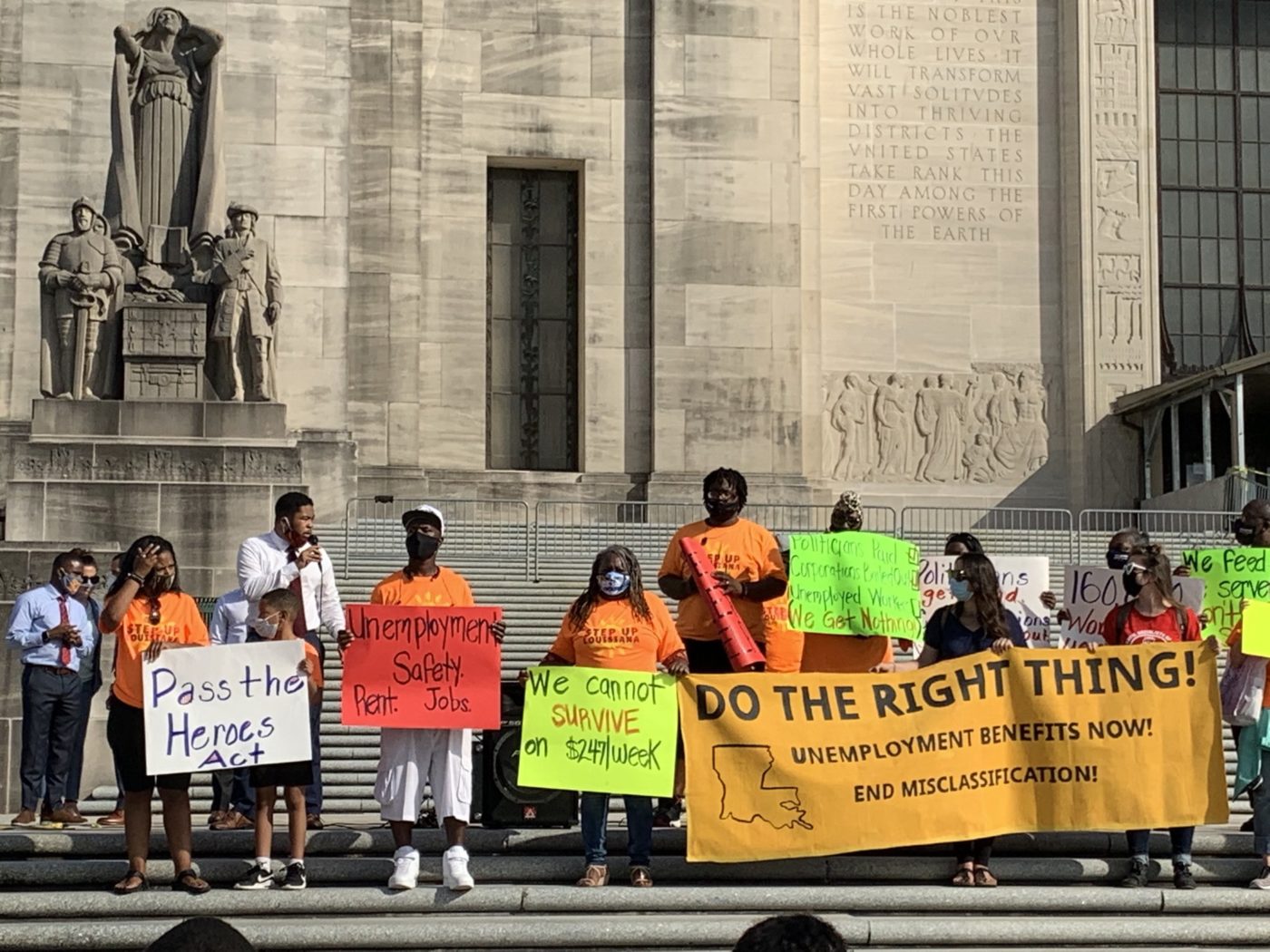 protestors holding signs