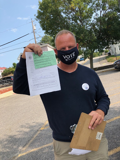Man holding voter registration