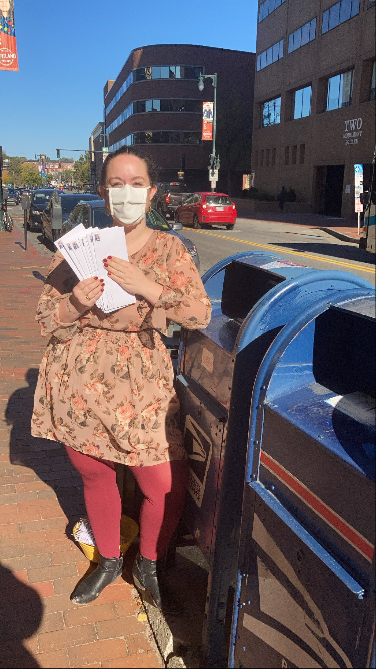 Woman holding letters to be mailed