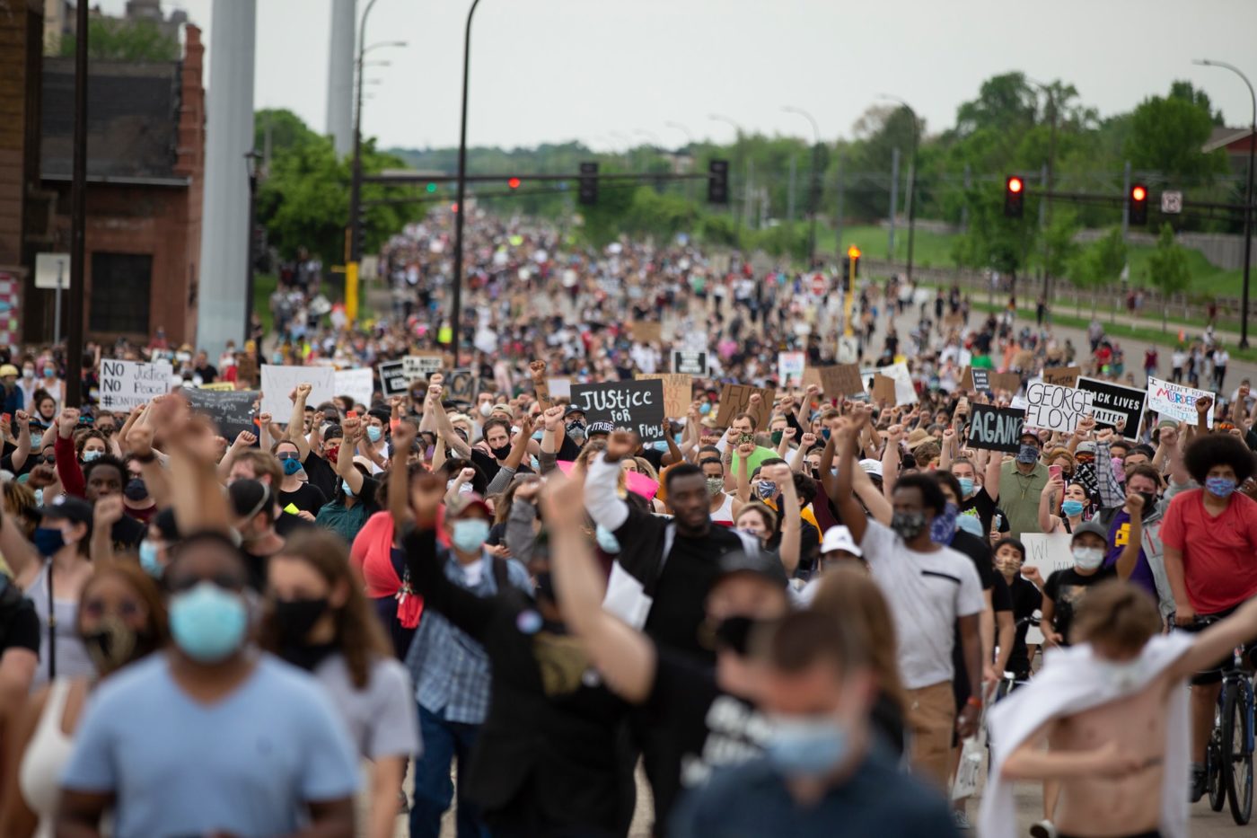 Group of protestors marching down the street