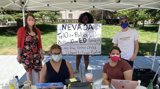 Group of people in Nevada with a sign