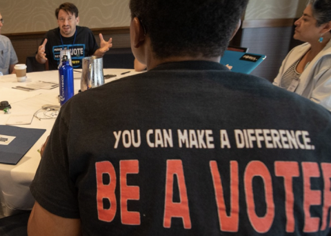 man with a shirt that says you can make a differenc be a voter