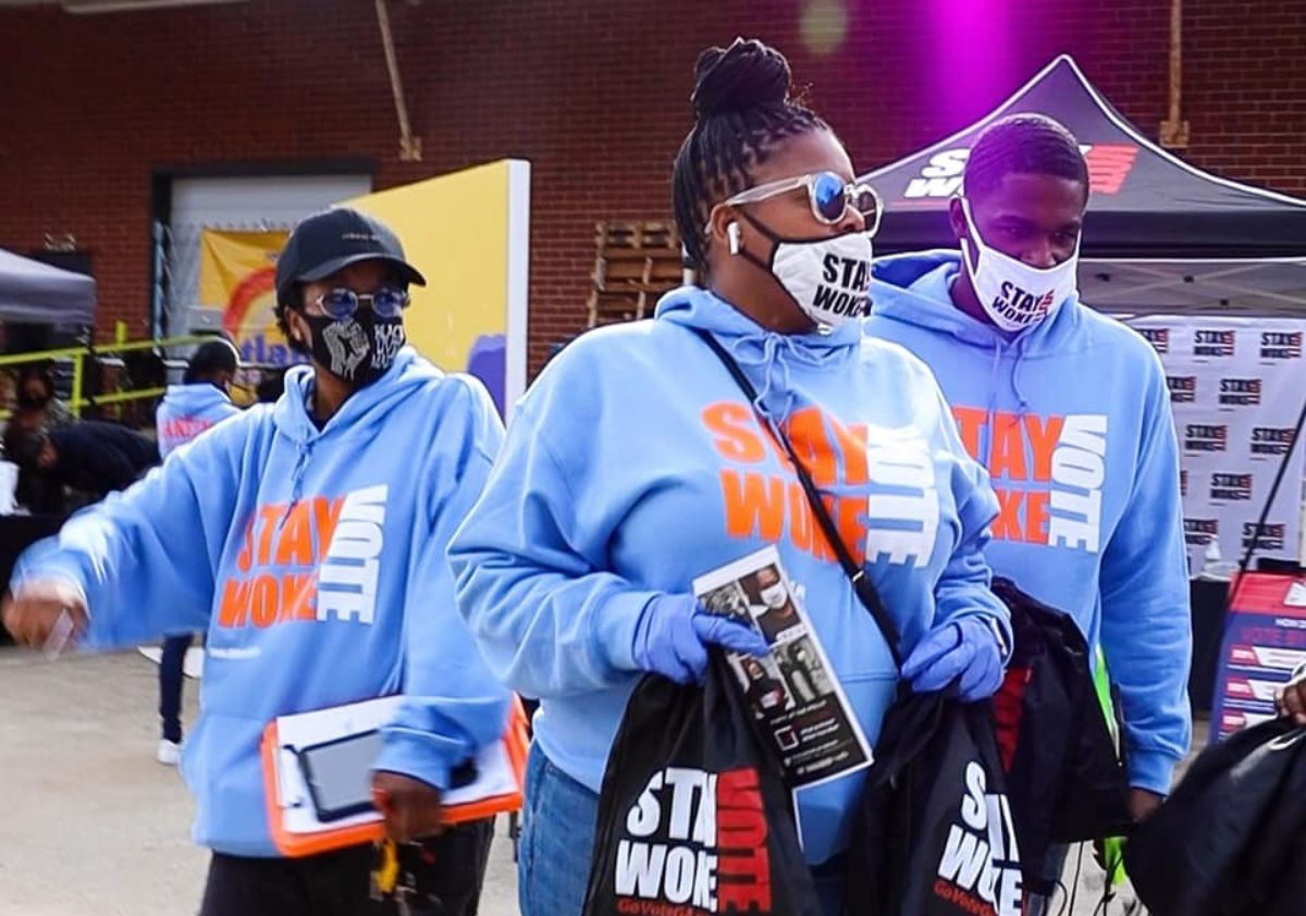 ProGeorgia organizers mobilize at a local Atlanta market to help register voters.