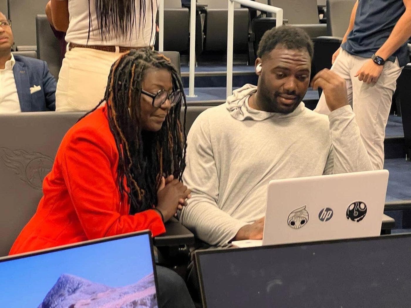Matia Powell, Executive Director of CivicTN, works with the Tennessee Titans at a text bank for National Voter Registration Day. (Image Credit: the Titans Community)