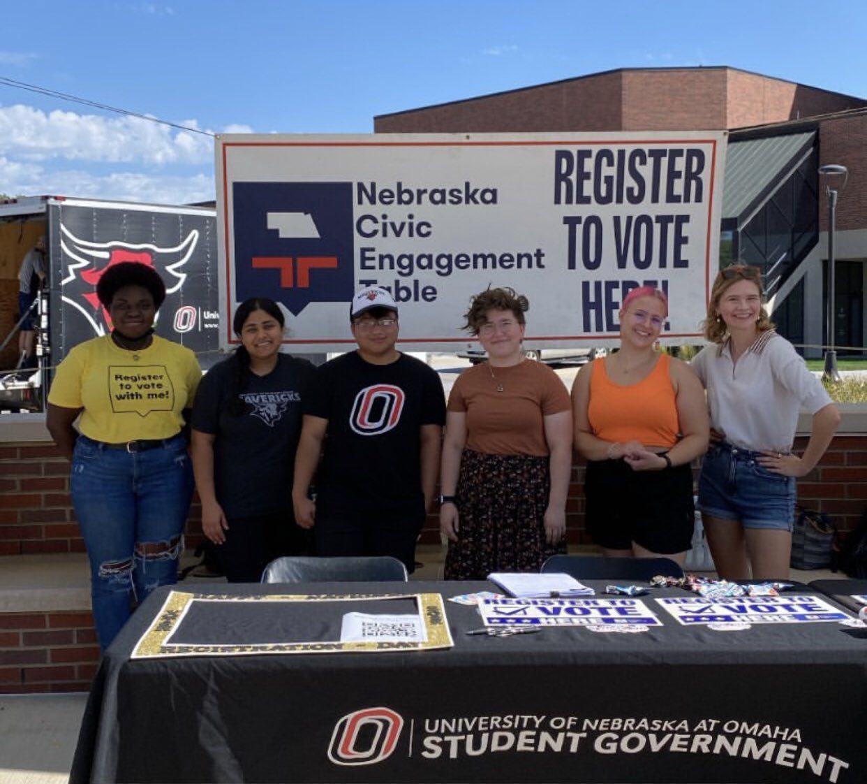 Organizers and advocates with Nebraska Civic Engagement Table helping register college students to vote.
