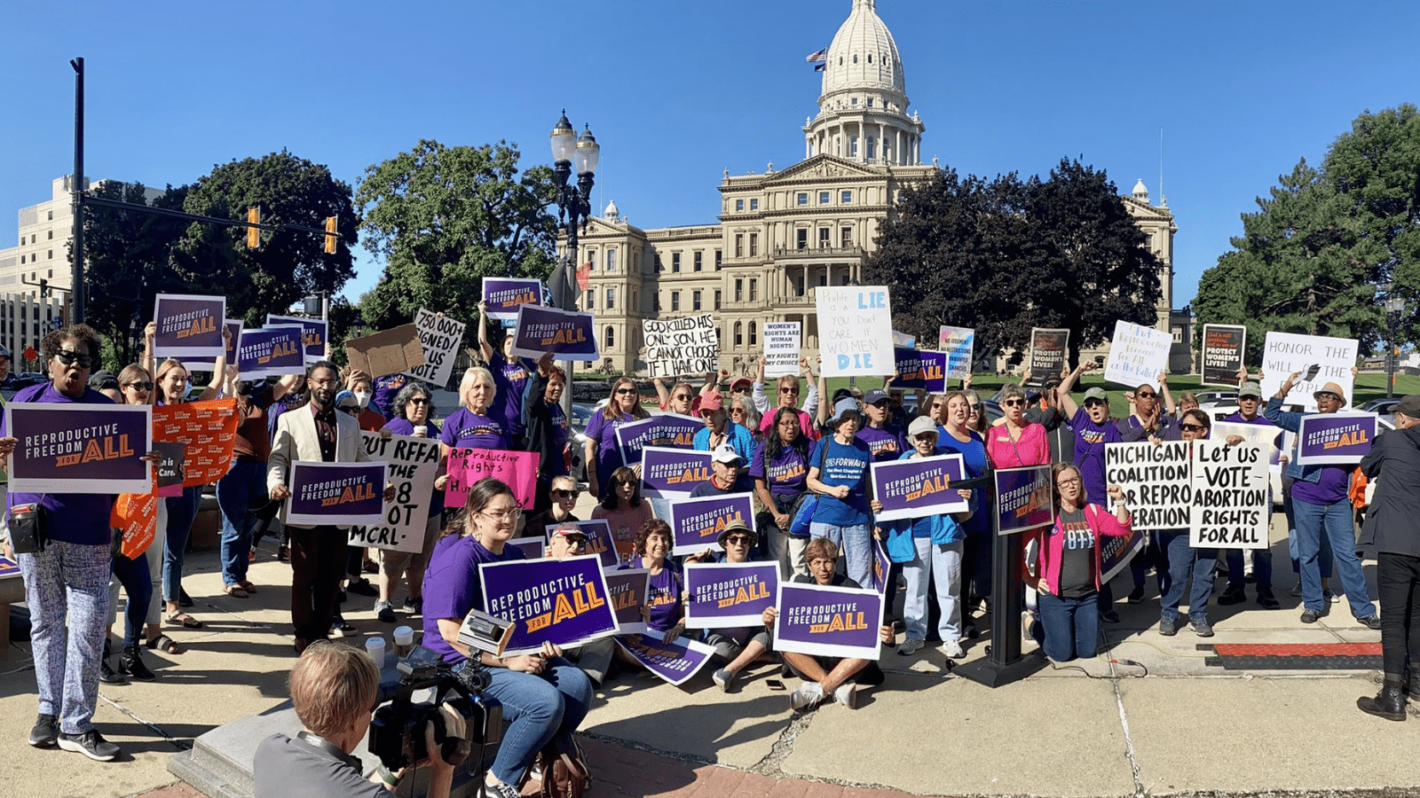 Volunteers with Michigan Voices’ partners and the Reproductive Freedom for All campaign rally outside the state capitol.