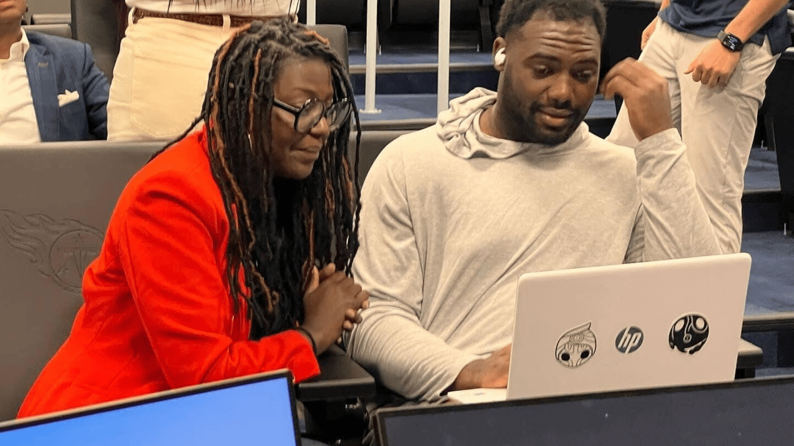 Matia Powell of Civic TN works with a member of the Tennessee Titans during a phone bank. 