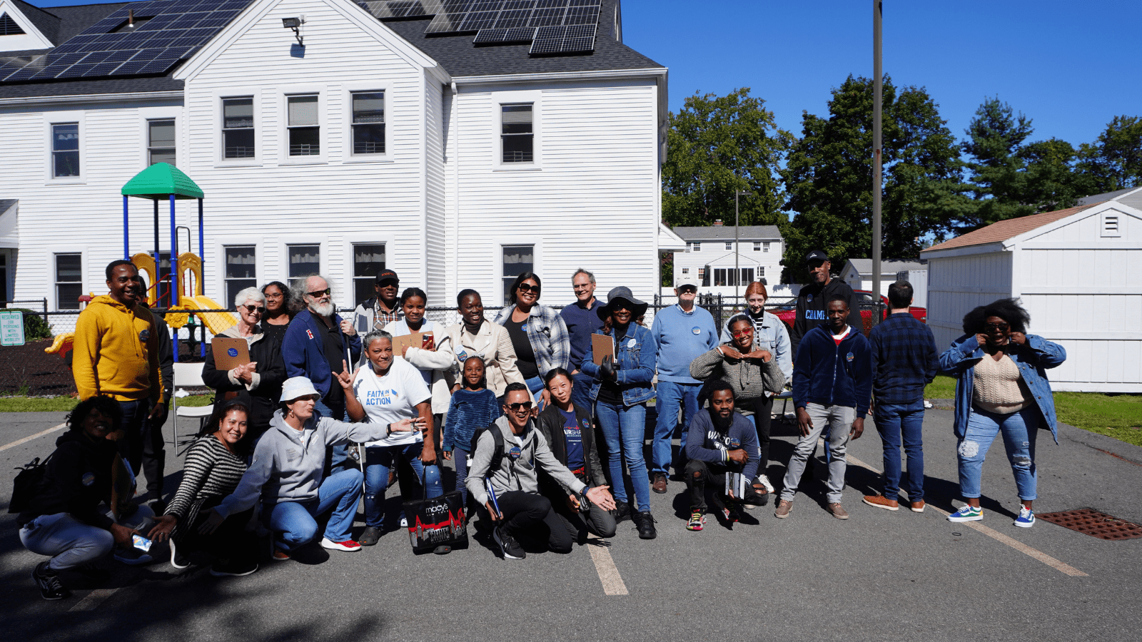 Volunteers with Massachusetts Voter Table and their partners pose before canvassing.