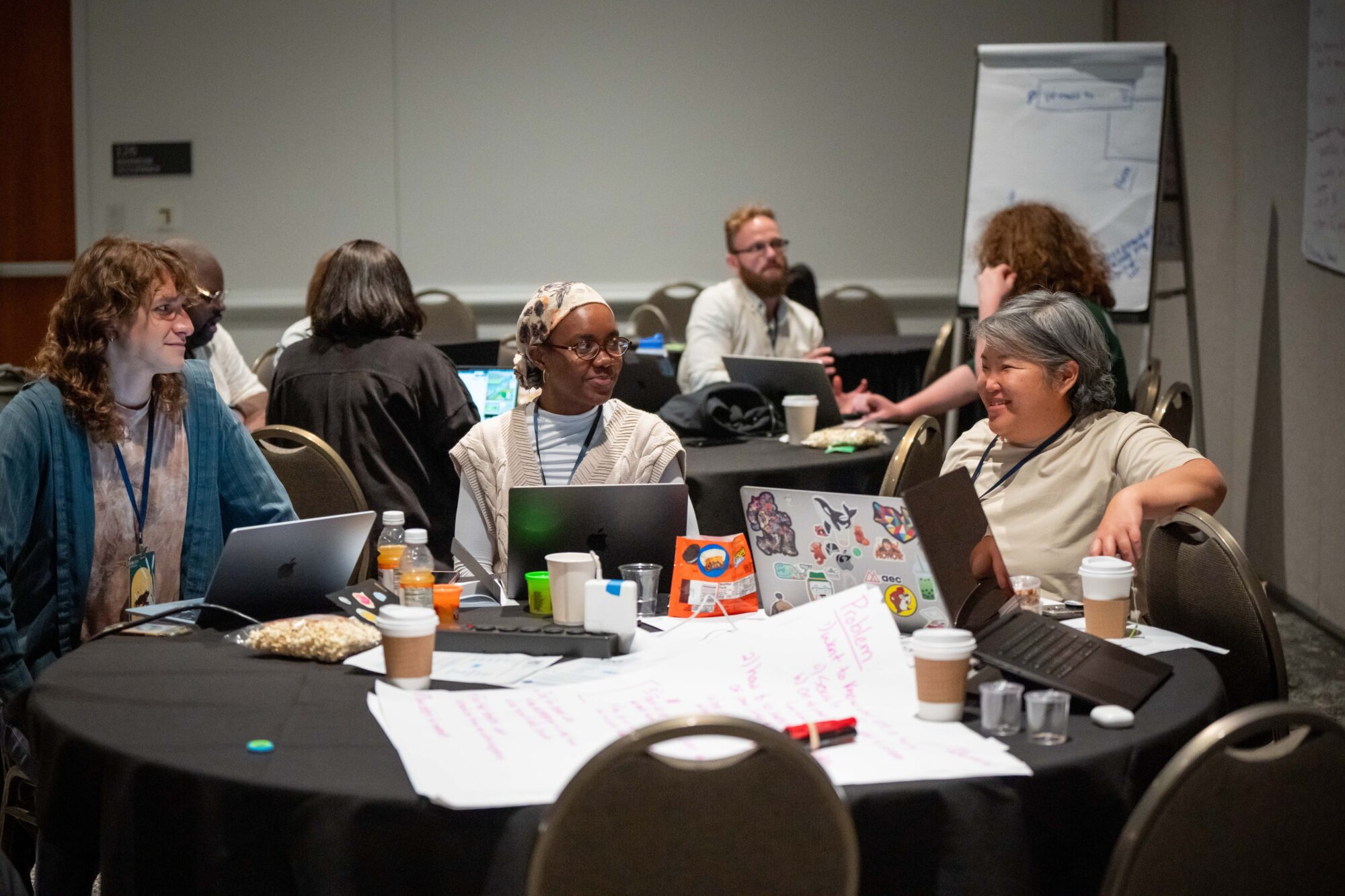 A group of people work on their laptops at Changemaker Skills Camp. Changemaker Skills Camp is a 3.5-day training intensive for the progressive community taking place October 14–17, 2025, at the Baird Center in Milwaukee, WI. (Photos by Eric Elofson, Rope Line Media)